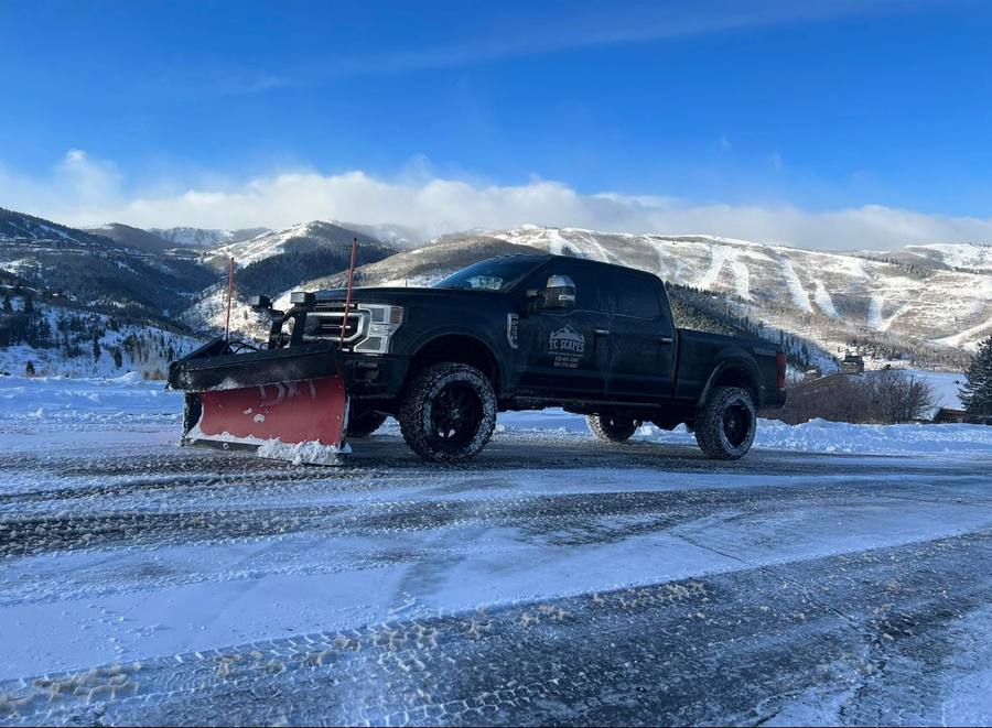 TC Scapes snow plow truck Park City Utah mountains