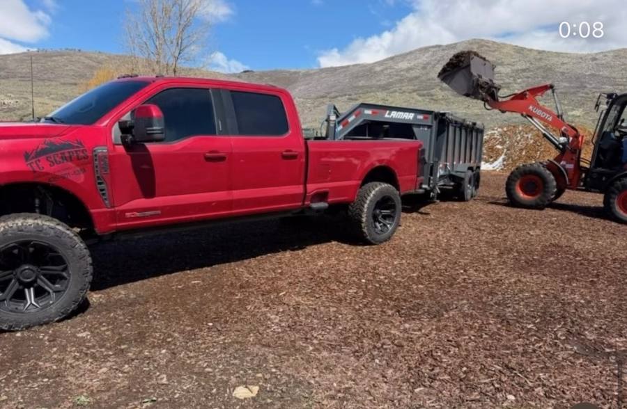 TC Scapes red truck Kubota loader mulch Summit County